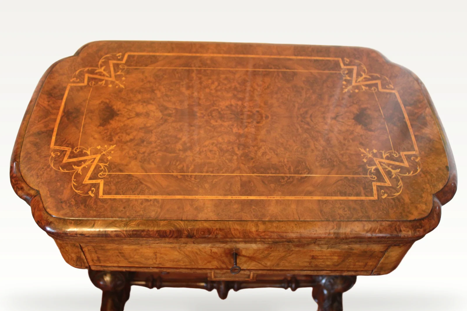A Victorian burr walnut games sewing table — view 3