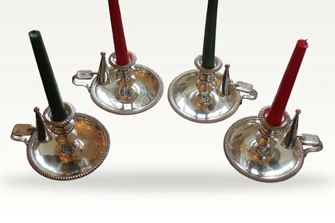 A rare set of four early 19th century silver plated chamber sticks