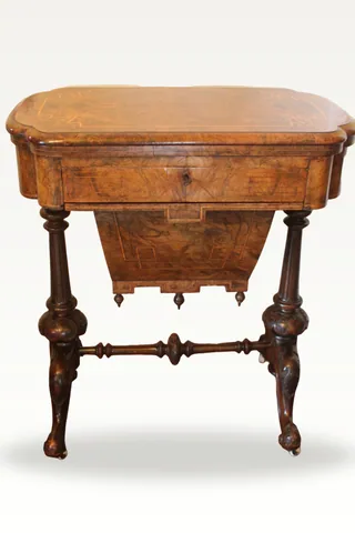A Victorian burr walnut games sewing table
