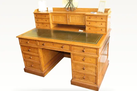 A Victorian oak pedestal desk by James Lamb